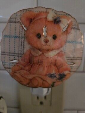 Teddy Bear Design Night Light On A Natural Sand Dollar